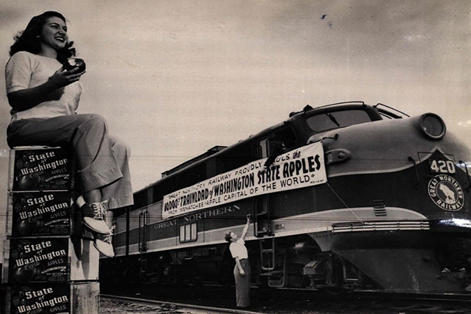Appleland Princess Lois Banghart helps celebrate GN’s 10,000th trainload of apples out of the Wenatchee area in 1947.