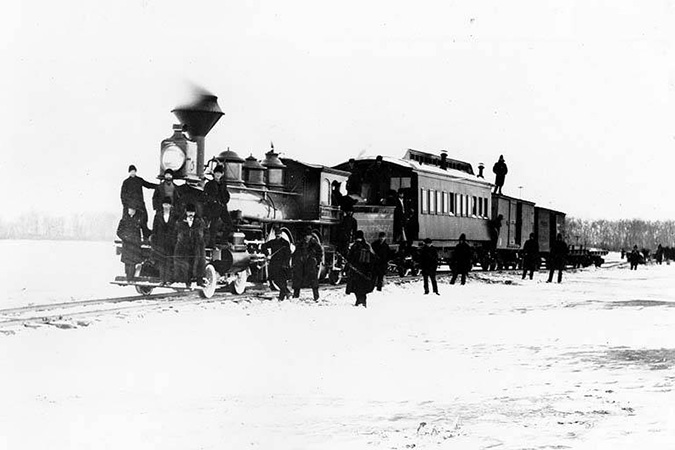 A Northern Pacific train crosses the Missouri River on tracks over the ice near Bismarck, North Dakota in March 1879. A Northern Pacific train crosses the Missouri River on tracks over the ice near Bismarck, North Dakota in March 1879.