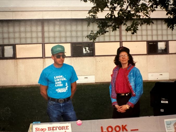 Dale Dannewitz volunteers with Locomotive Engineer Cheri Bonebrake at an Operation Lifesaver event circa 1994. Dale Dannewitz volunteers with Locomotive Engineer Cheri Bonebrake at an Operation Lifesaver event circa 1994.