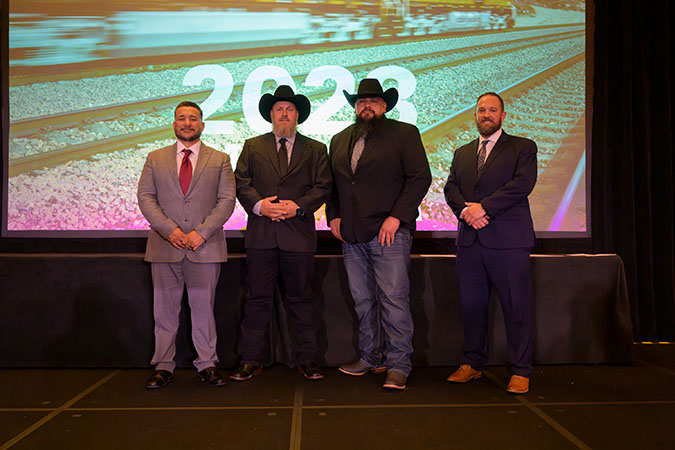 Left to right, members of the team recognized at BNSF’s Employees of the Year: Mark Roybal, Jon Mecham, Nick Garibay, and Nick DeRieux Left to right, members of the team recognized at BNSF’s Employees of the Year: Mark Roybal, Jon Mecham, Nick Garibay, and Nick DeRieux