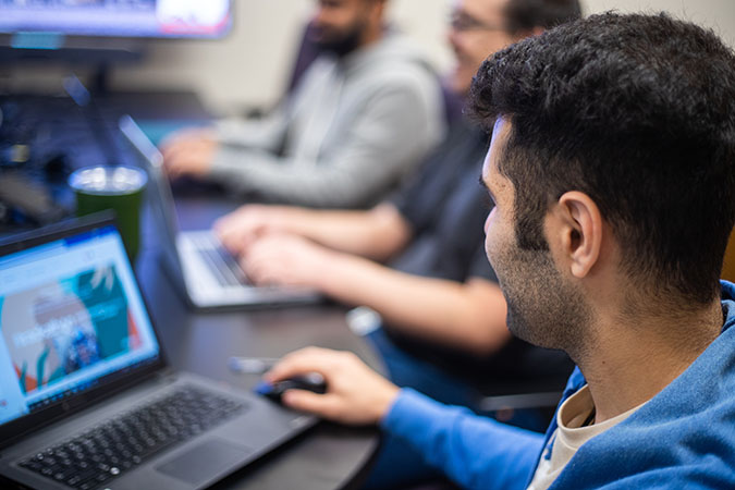 Trackathon team members collaborate. Trackathon team members collaborate.