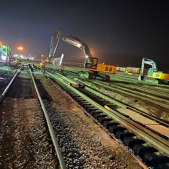 Installation of new skate retarders, which are placed at the end of the hump to safely stop rail cars. Installation of new skate retarders, which are placed at the end of the hump to safely stop rail cars.